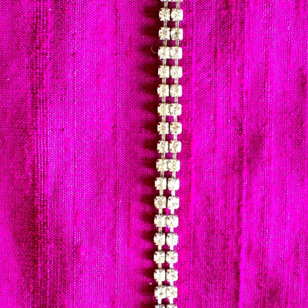 Silver tennis bracelet, like new.